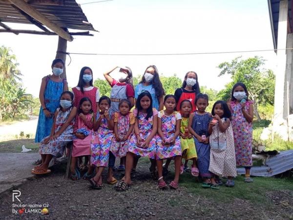 Many children received a new dress because of the generosity of Ct. St. Augustine members who purchased material and sewed the new dresses for the young girls from the Philippines.